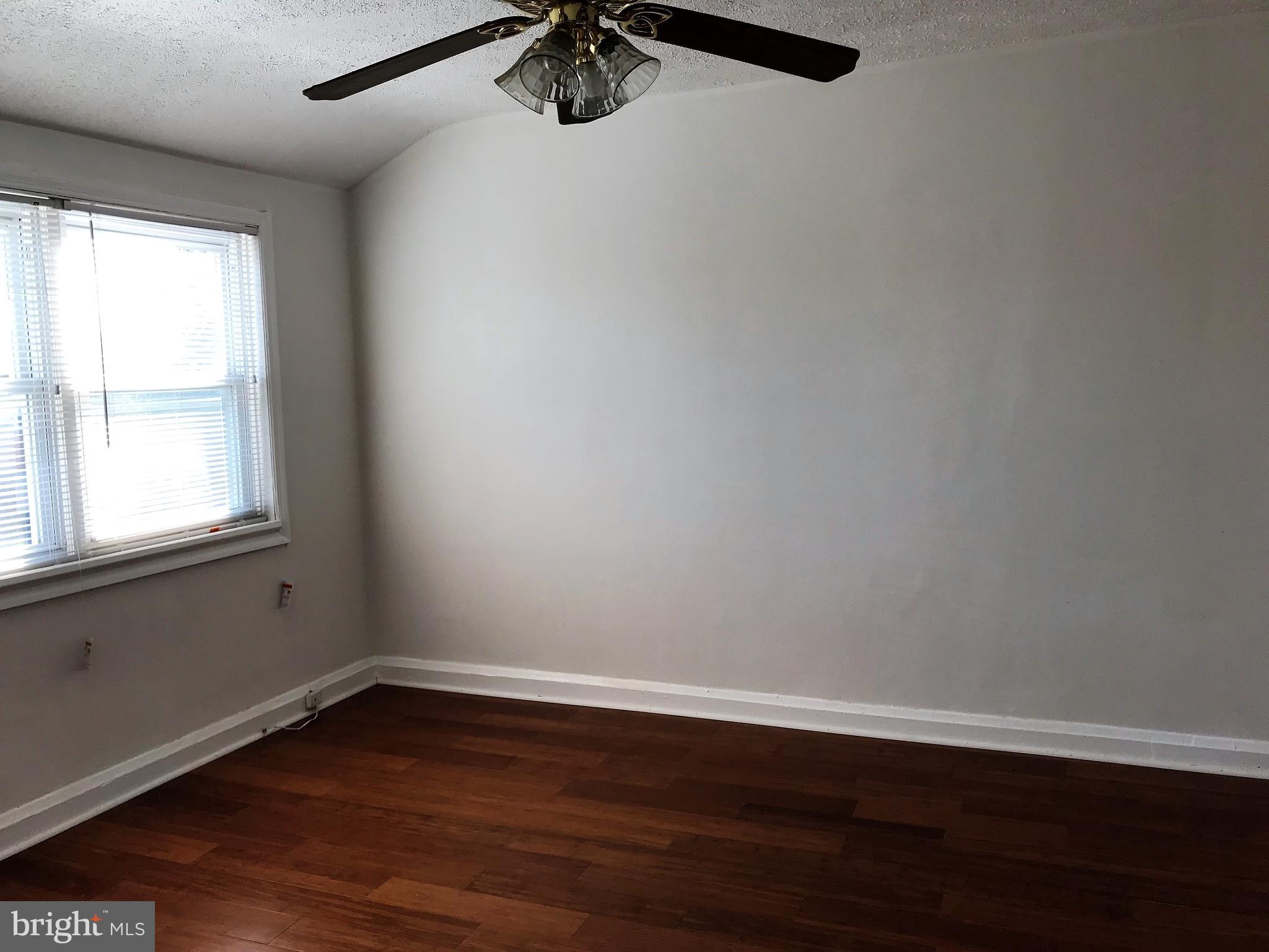 1905 Barry Road Dundalk, MD 21222 - Photo 8 of 23 a view of a room with wooden floor and windows