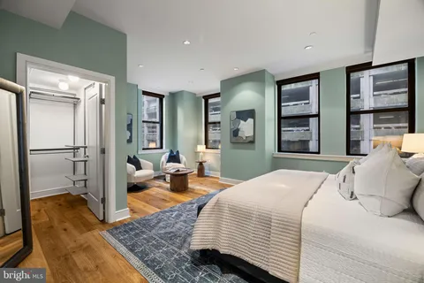 a living room with furniture and a painting