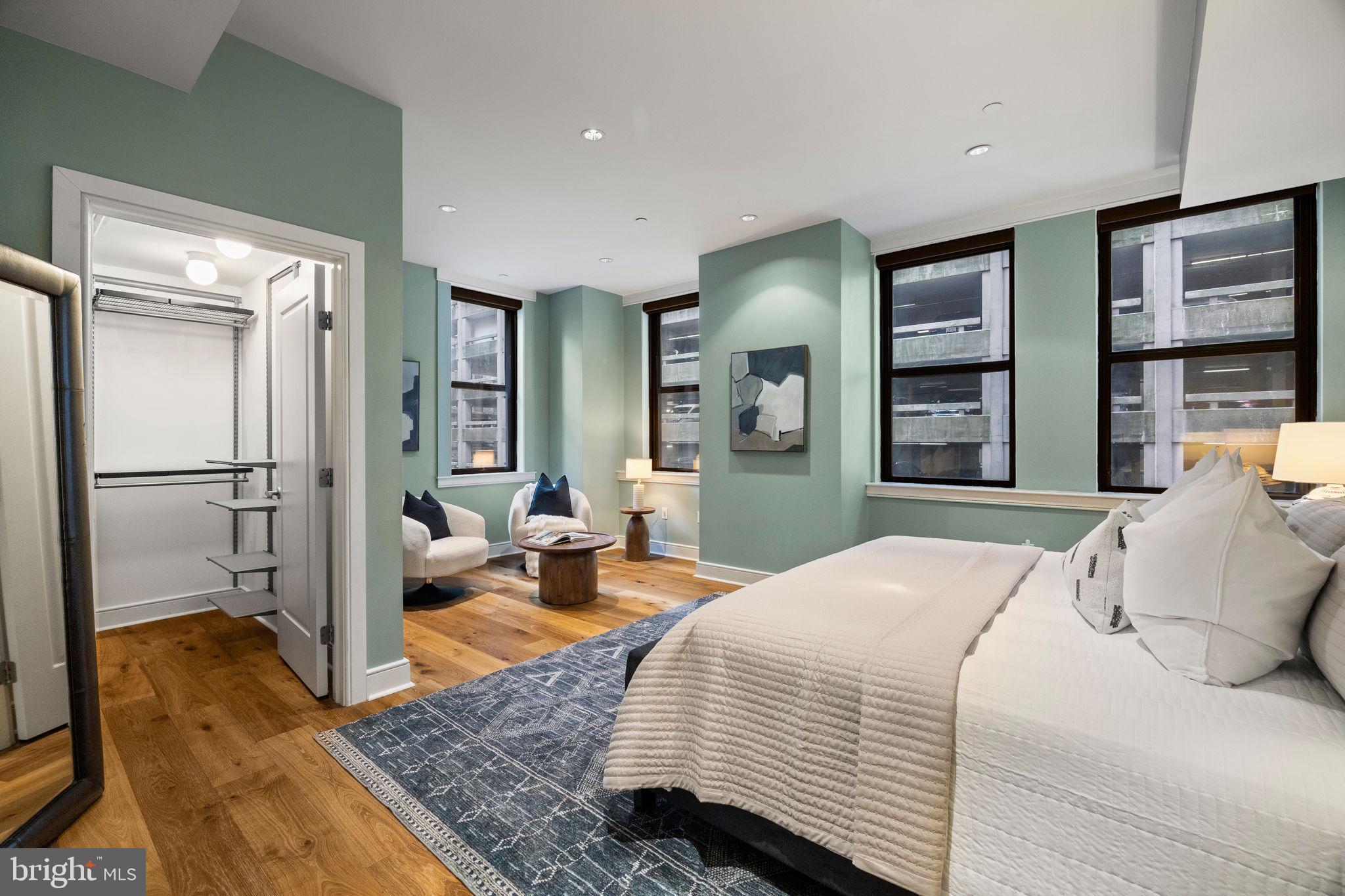 1515 Locust Street, Unit 401 Philadelphia, PA 19102 - Photo 15 of 35 a bedroom with a bed and wooden floor