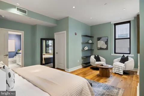 a bathroom with a tub and a view of bathroom