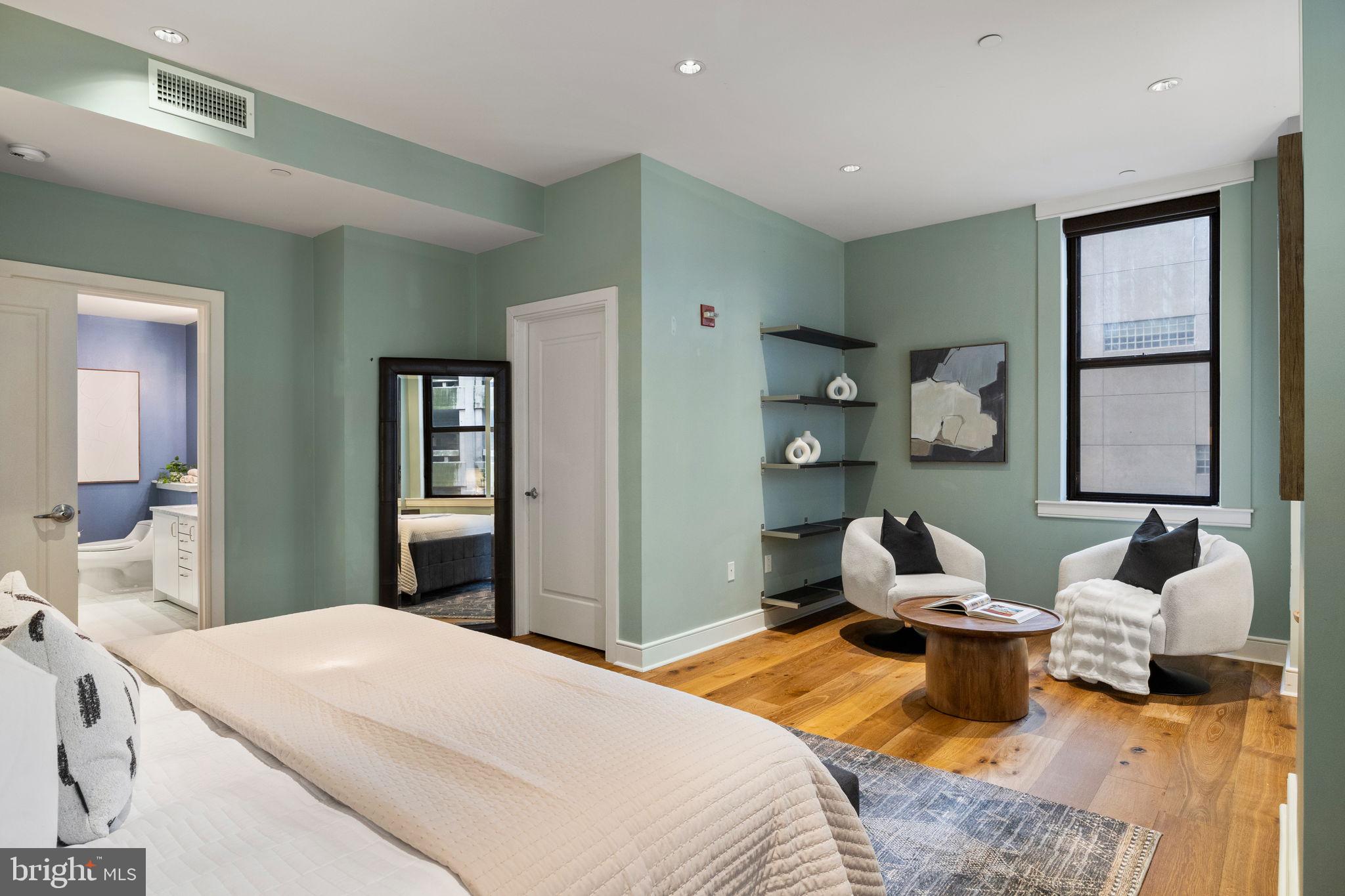 1515 Locust Street, Unit 401 Philadelphia, PA 19102 - Photo 17 of 35 a bedroom with a bed and window