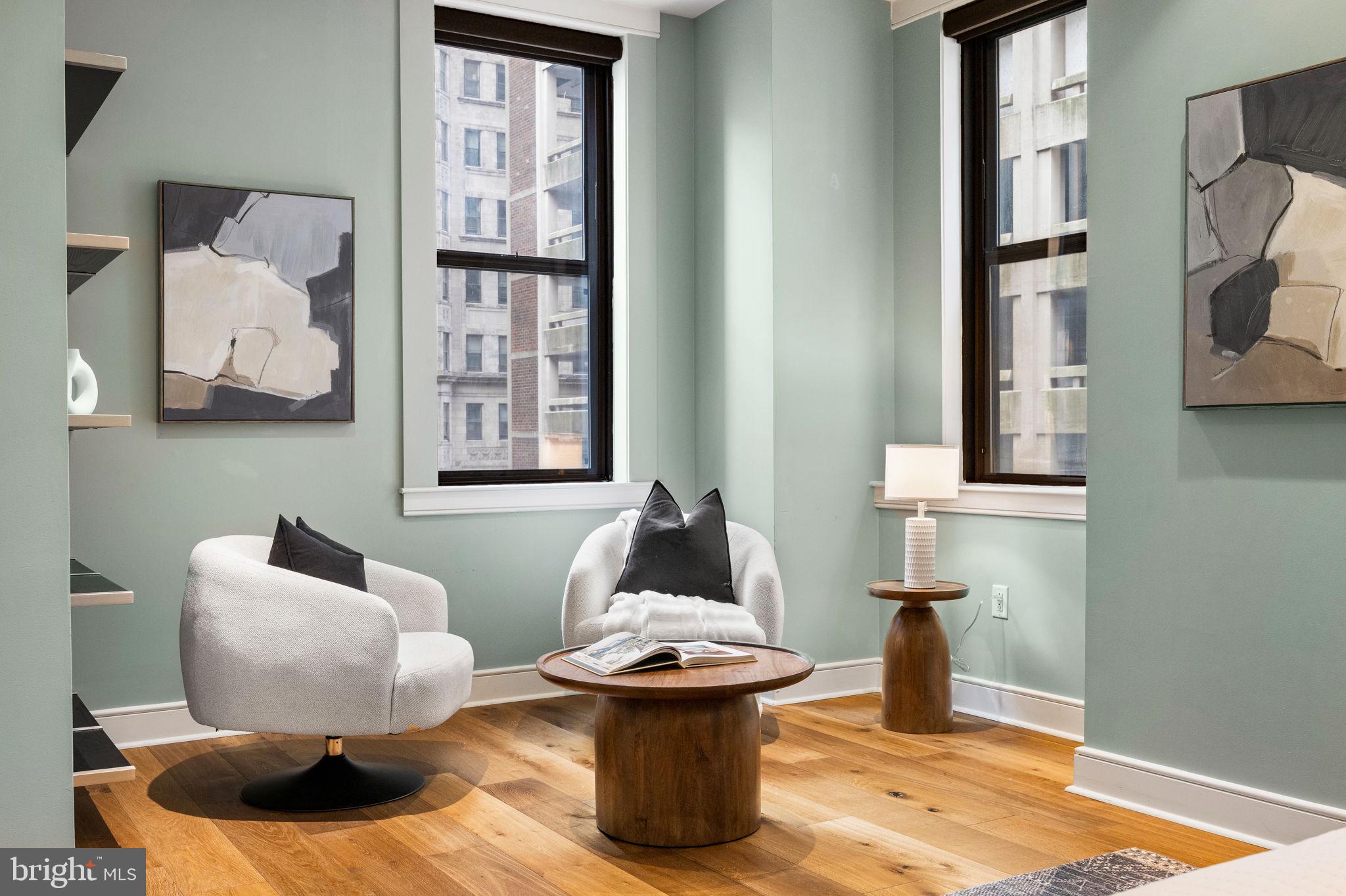 1515 Locust Street, Unit 401 Philadelphia, PA 19102 - Photo 18 of 35 a living room with furniture and a painting