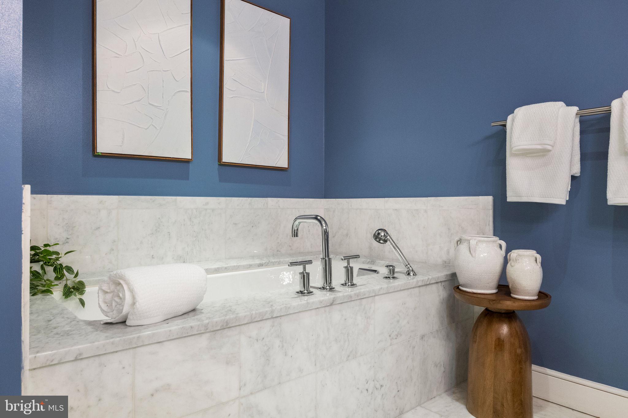 1515 Locust Street, Unit 401 Philadelphia, PA 19102 - Photo 23 of 35 a bathroom with a sink and a mirror