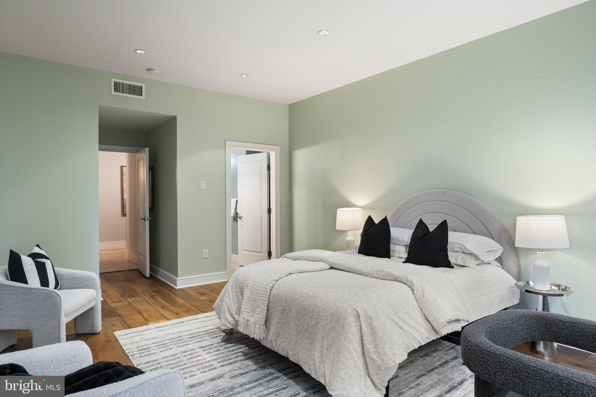 1515 Locust Street, Unit 401 Philadelphia, PA 19102 - Photo 28 of 35 a bedroom with a bed and a couch