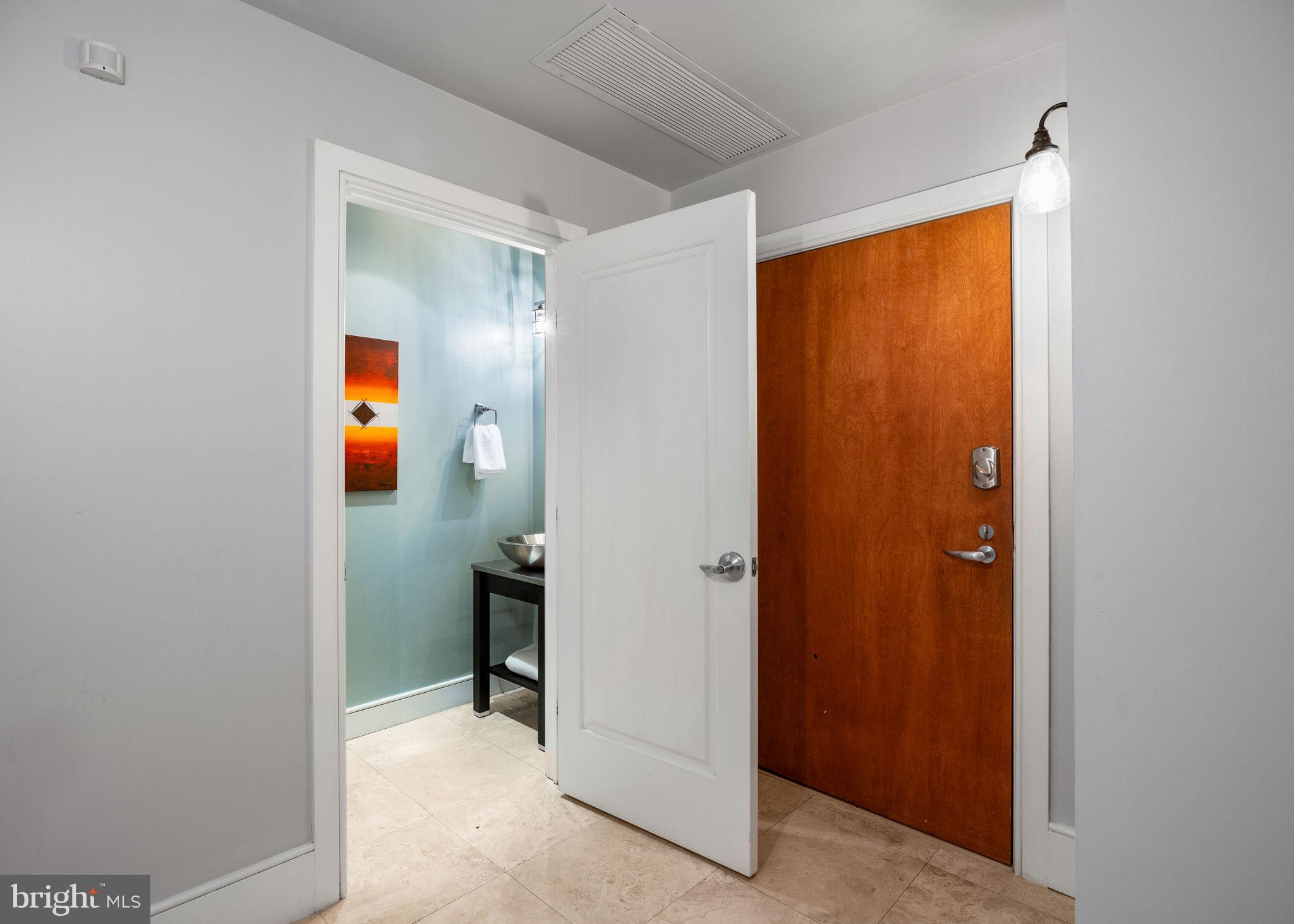 1515 Locust Street, Unit 401 Philadelphia, PA 19102 - Photo 31 of 35 a view of a bathroom from a hallway