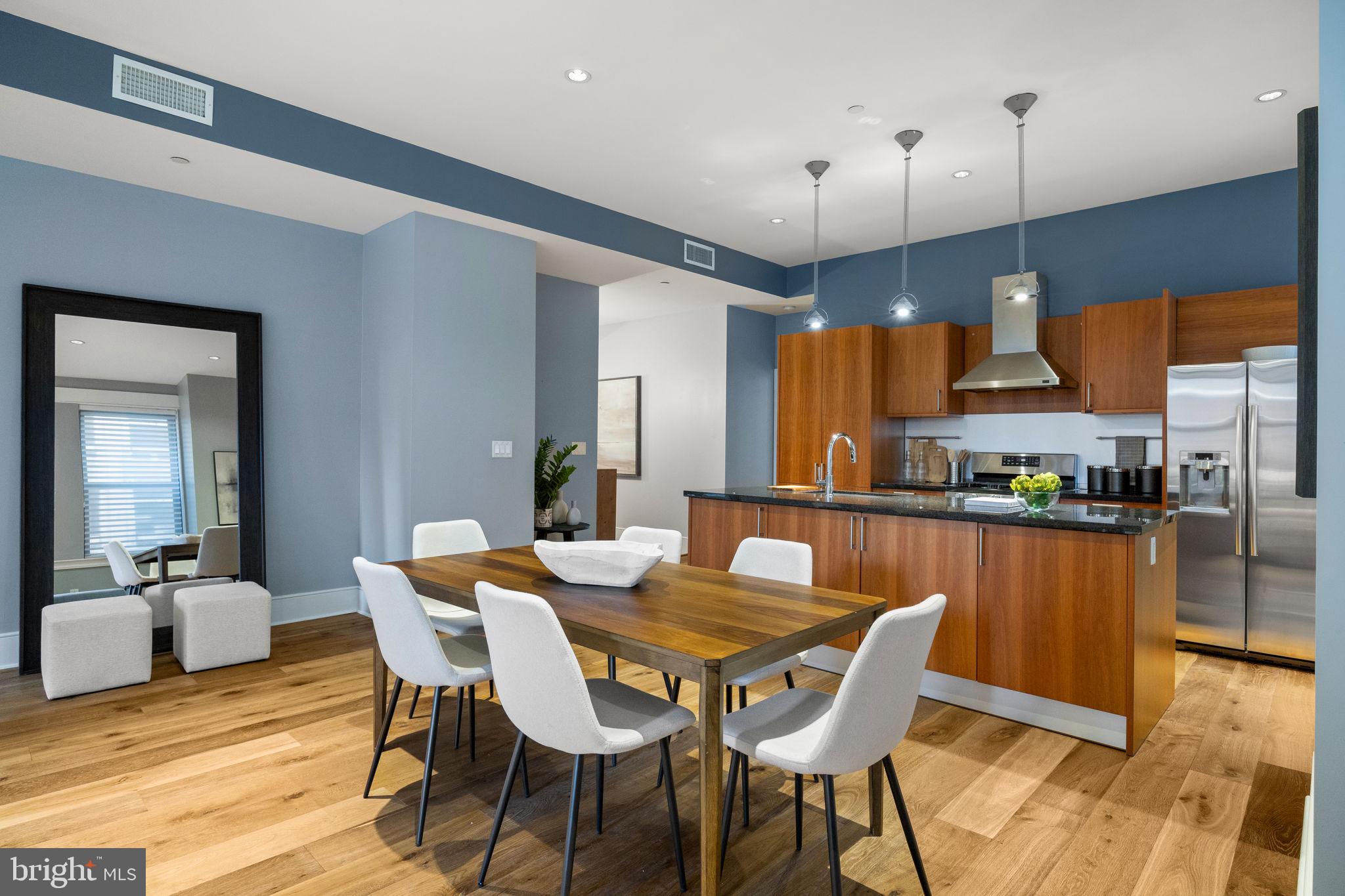 1515 Locust Street, Unit 401 Philadelphia, PA 19102 - Photo 8 of 35 a view of a dining room with furniture window and wooden floor
