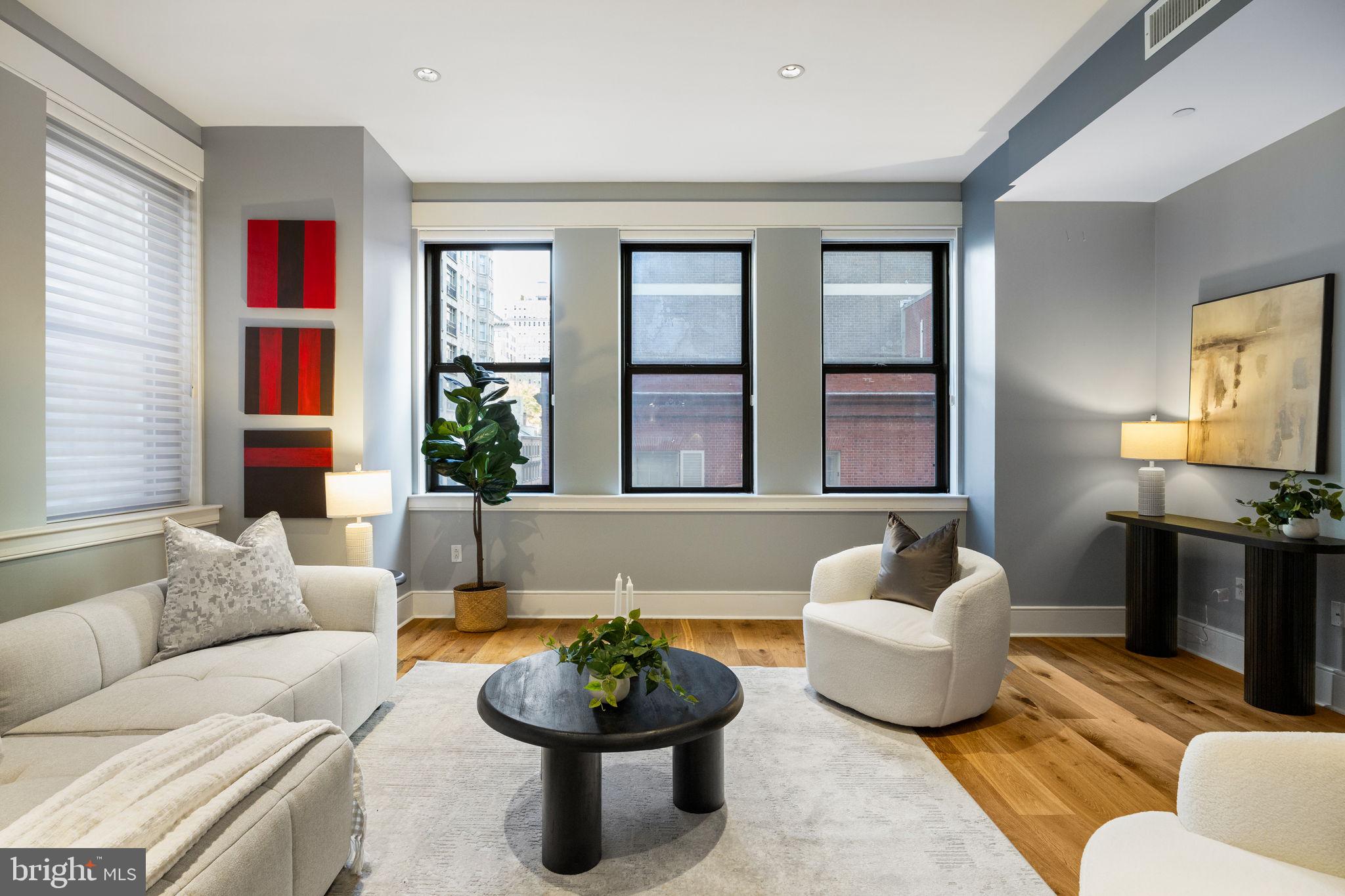 1515 Locust Street, Unit 401 Philadelphia, PA 19102 - Photo 9 of 35 a living room with furniture and a potted plant