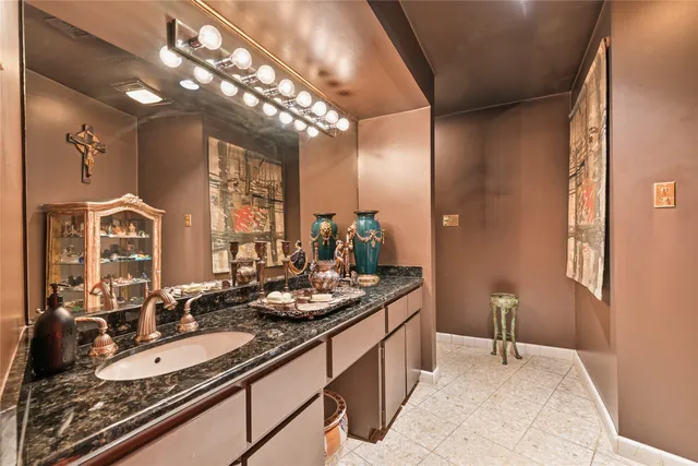 a bathroom with a double vanity sink and a mirror