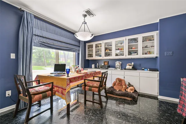a view of a dining room with furniture window and outside view