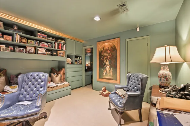 a bedroom with furniture and a window