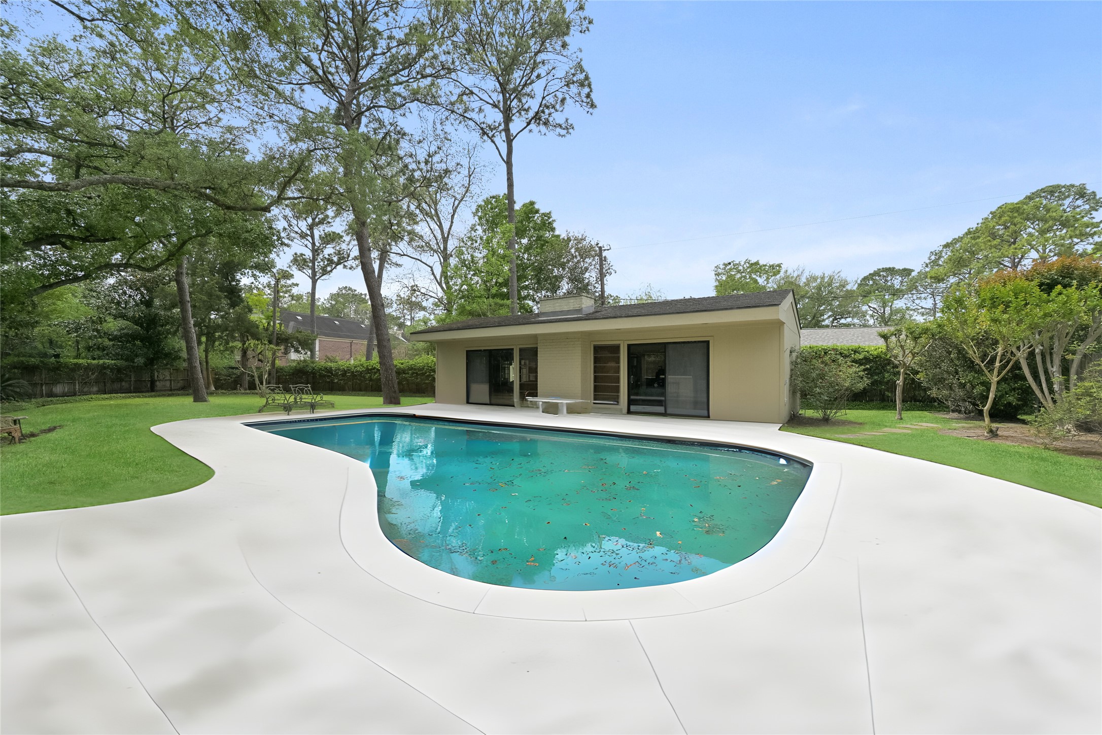 435 Flint Point Drive Piney Point Village, TX 77024 - Photo 21 of 32 a view of a house with swimming pool and yard