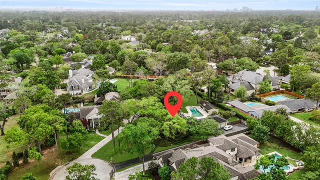 an aerial view of residential houses with city view
