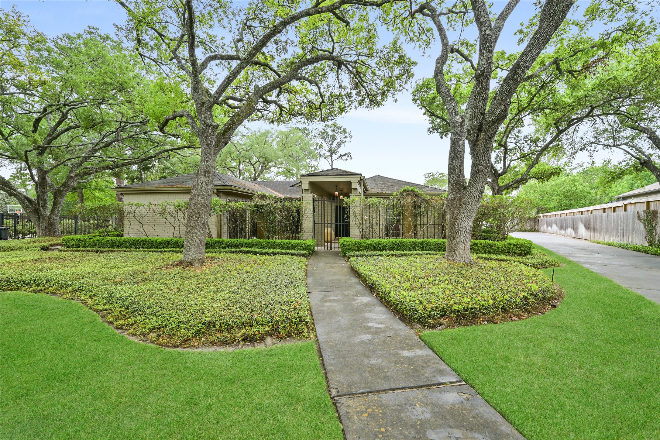 435 Flint Point Drive Piney Point Village, TX 77024 - Photo 4 of 32 a front view of a house with a yard