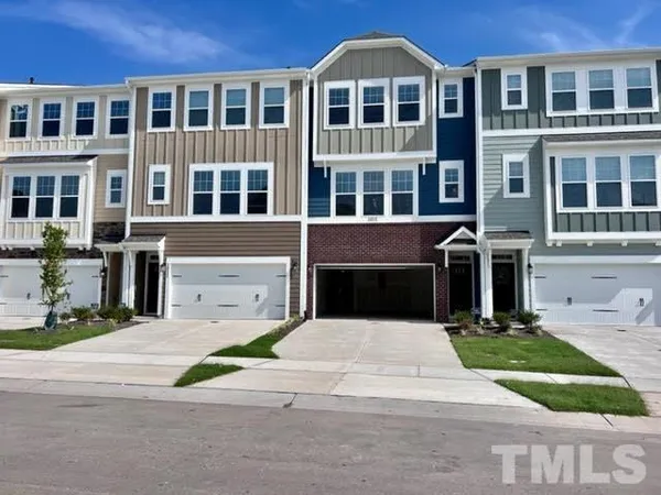 a view of a brick building with many windows