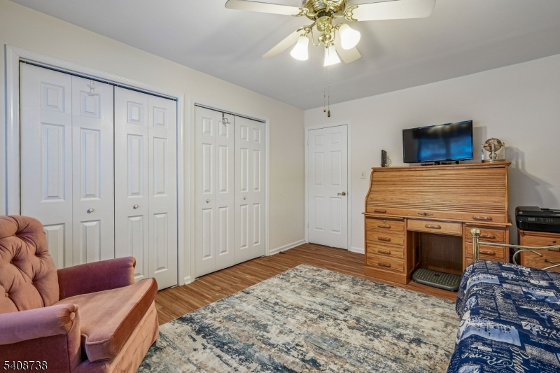 27 Espy Road, Unit A7 Caldwell, NJ 07006 - Photo 18 of 29 a bedroom with a bed and a couch