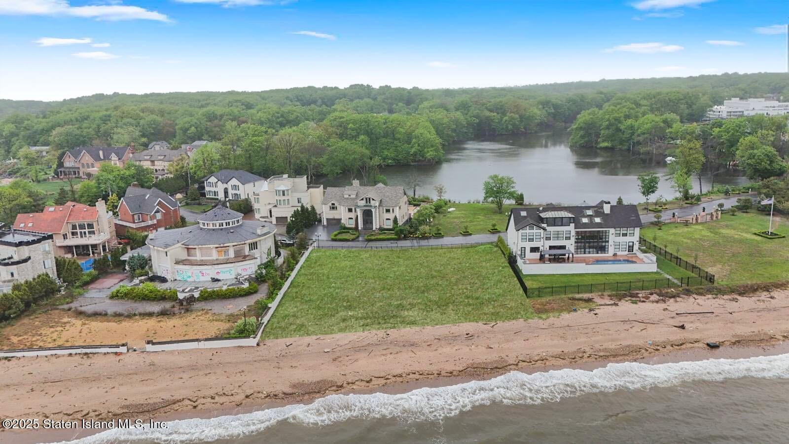 140 Nicolosi Drive Staten Island, NY 10312 - Photo 2 of 7 a view of a street with a park