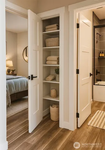 a bedroom with a bed and a view of bathroom