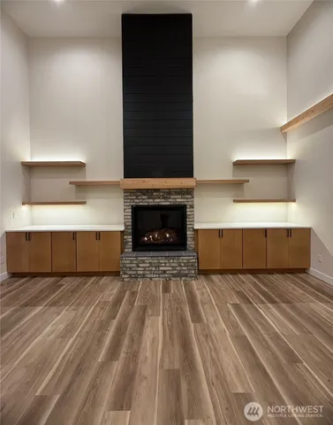 a bedroom with a bed and a fireplace