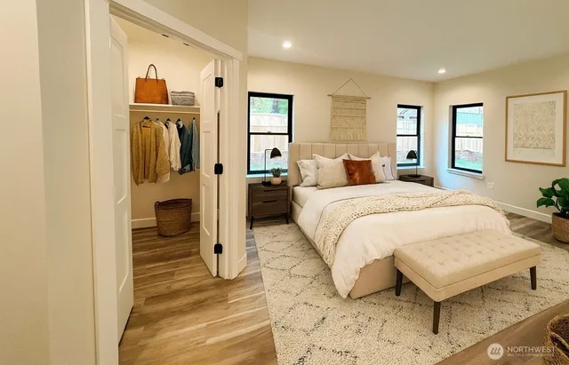 a bedroom with a bed and a mirror