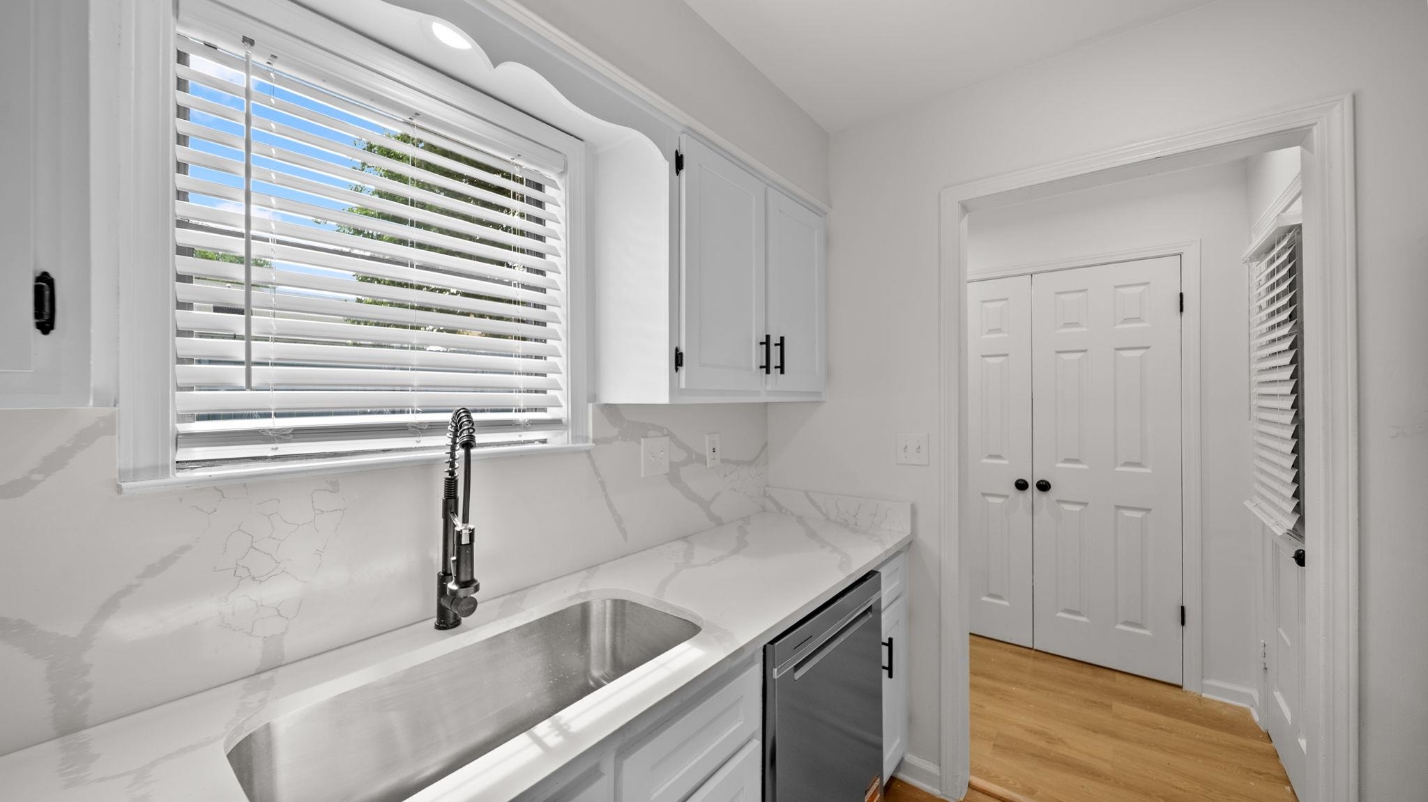 4351 Spring Oak Cove Memphis, TN 38125 - Photo 17 of 40 a kitchen with a sink and a window