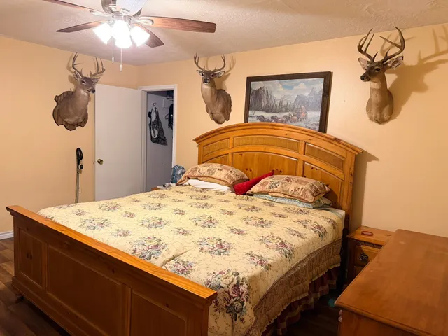 a bed sitting in a bedroom and a chandelier