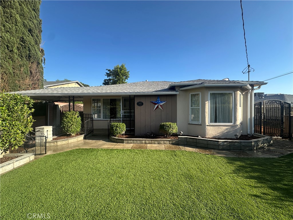 7918 Kyle Street Sunland, CA 91040 - Photo 18 of 18 a front view of a house with a yard