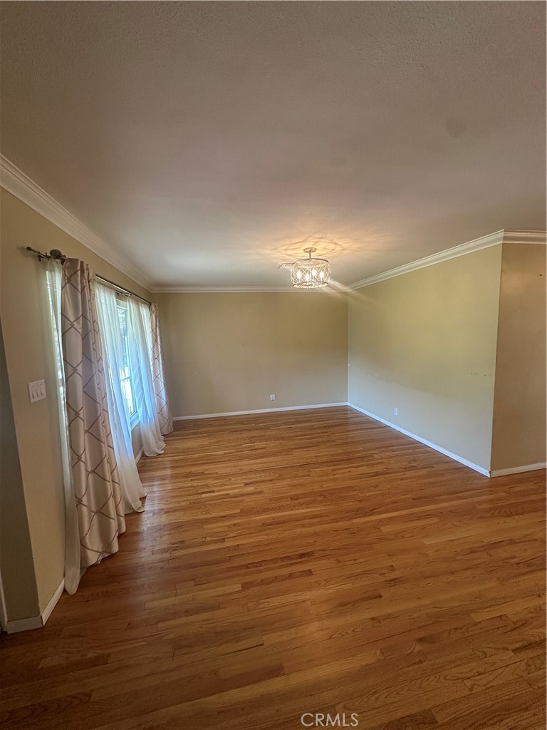 7918 Kyle Street Sunland, CA 91040 - Photo 2 of 18 a view of an empty room with wooden floor