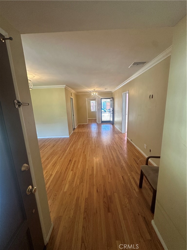 7918 Kyle Street Sunland, CA 91040 - Photo 4 of 18 a view of a room with wooden floor and staircase