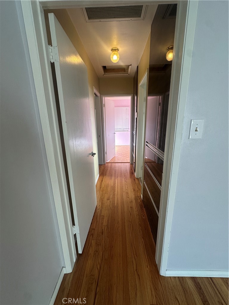 7918 Kyle Street Sunland, CA 91040 - Photo 7 of 18 a view of hallway with wooden floor