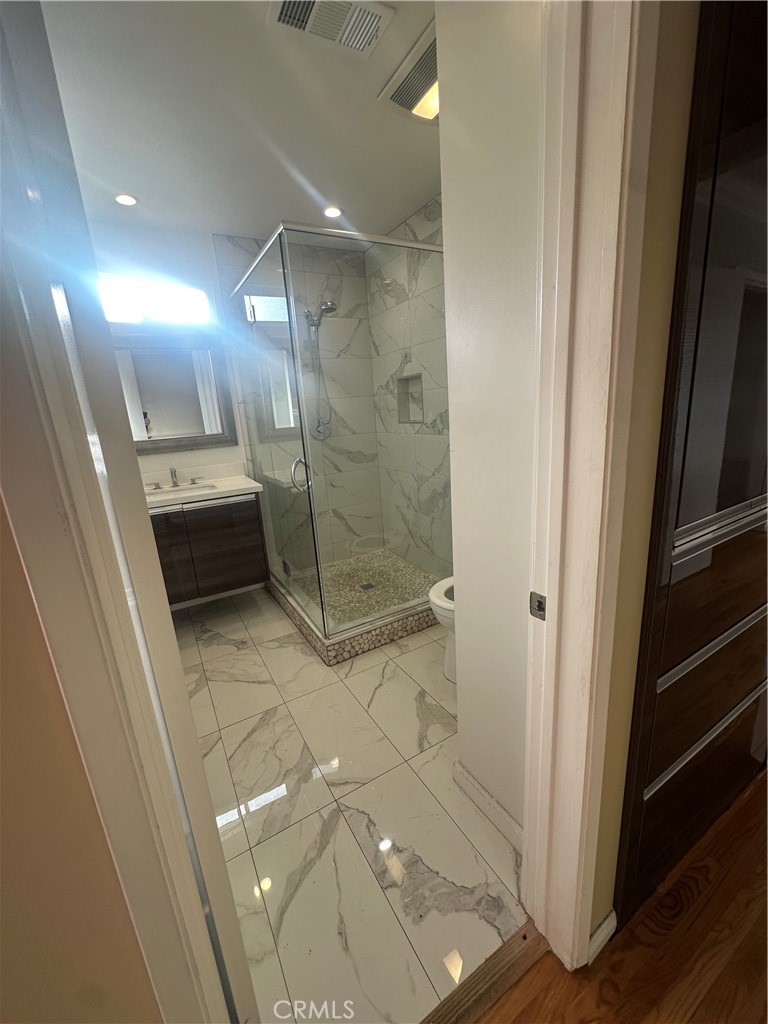 7918 Kyle Street Sunland, CA 91040 - Photo 8 of 18 a bathroom with a shower and a toilet