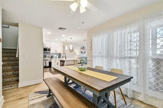 a view of a room with white door and wooden floor