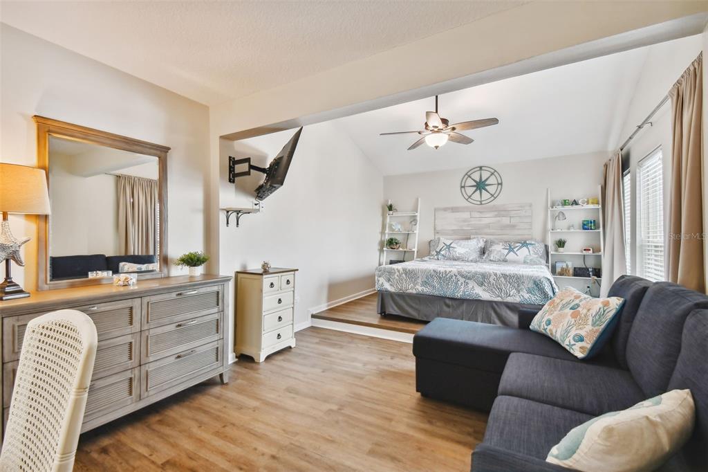 315 Medallion Boulevard, Unit E Madeira Beach, FL 33708 - Photo 40 of 78 a bedroom with furniture and a window