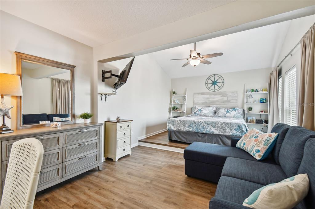 315 Medallion Boulevard, Unit E Madeira Beach, FL 33708 - Photo 41 of 78 a bedroom with furniture and a window