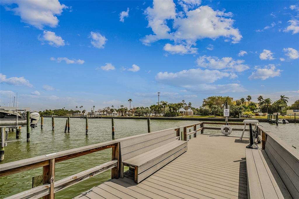 315 Medallion Boulevard, Unit E Madeira Beach, FL 33708 - Photo 60 of 78 a view of swimming pool with outdoor seating