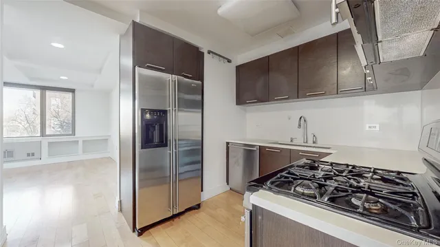 a kitchen with wooden cabinets and a stove top oven