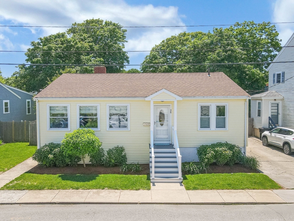 a aerial view of a house with a yard