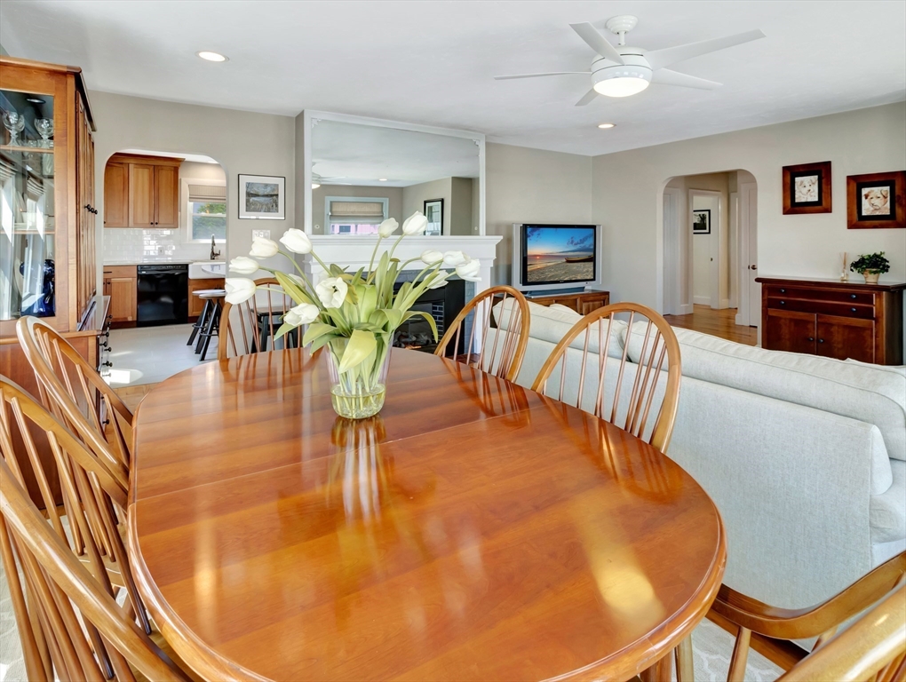 26 C Street Hull, MA 02045 - Photo 17 of 42 a living room with fireplace furniture and a view of kitchen