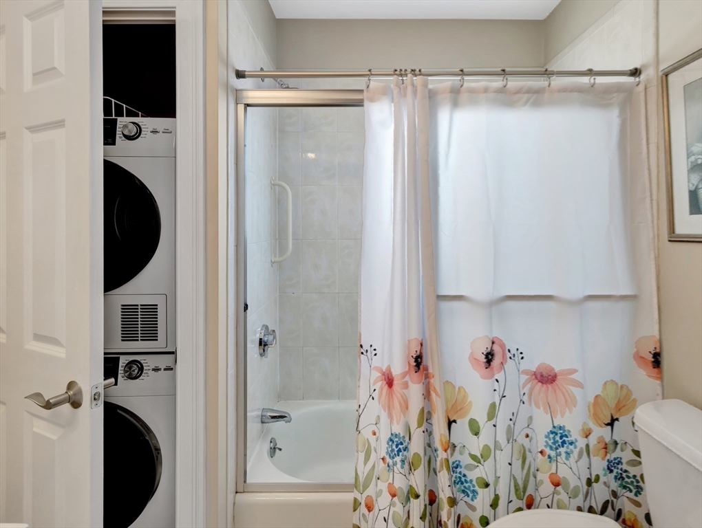 26 C Street Hull, MA 02045 - Photo 27 of 42 a view of a bedroom with a washer and dryer