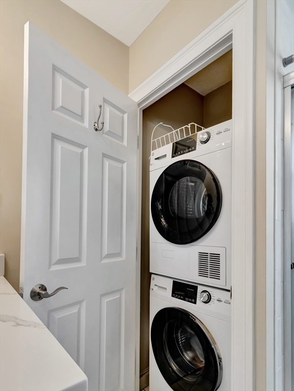 26 C Street Hull, MA 02045 - Photo 28 of 42 a utility room with dryer washer and a view of kitchen