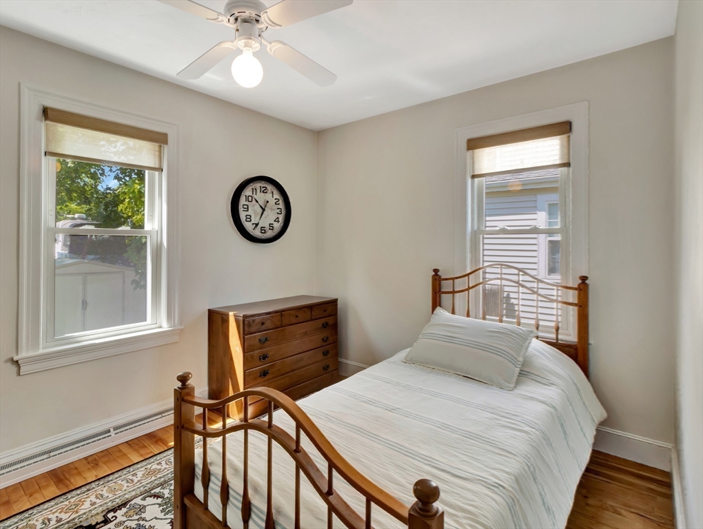 26 C Street Hull, MA 02045 - Photo 29 of 42 a bedroom with a bed and a window