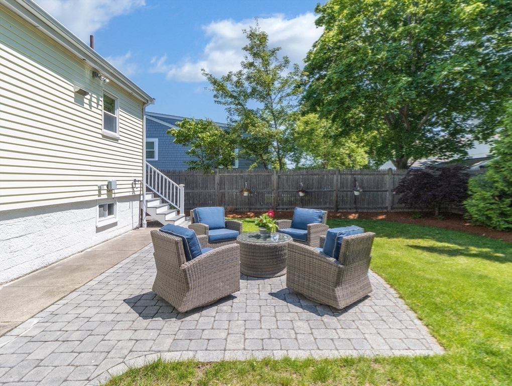 26 C Street Hull, MA 02045 - Photo 3 of 42 a view of a patio with couches chairs and a yard
