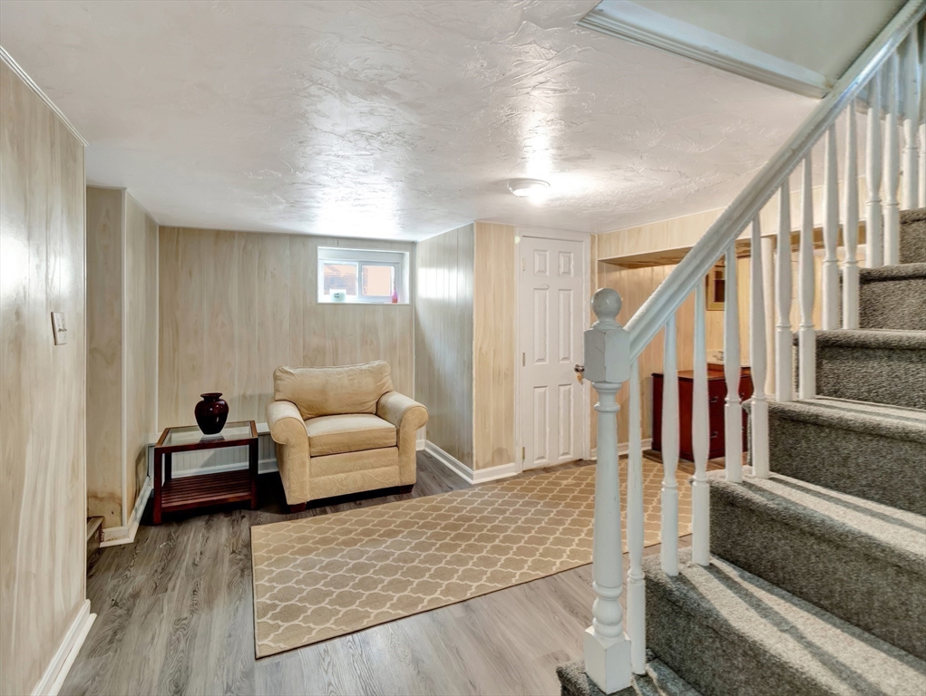 26 C Street Hull, MA 02045 - Photo 32 of 42 a living room with furniture and stairs