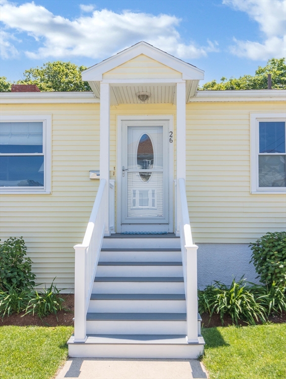 26 C Street Hull, MA 02045 - Photo 7 of 42 a view of a house with a large window and potted plants