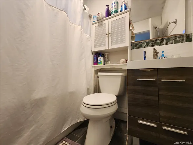 a bathroom with a toilet and a sink