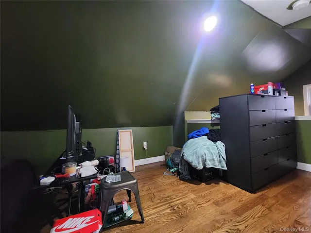 a bed room with a bed and a fan