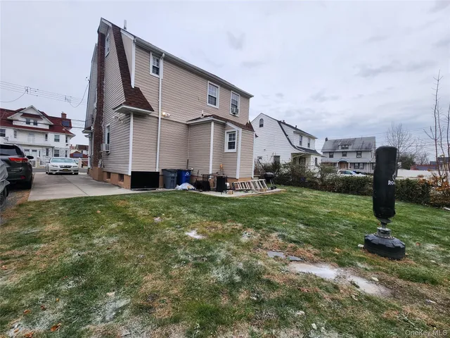 a view of city street with parked cars