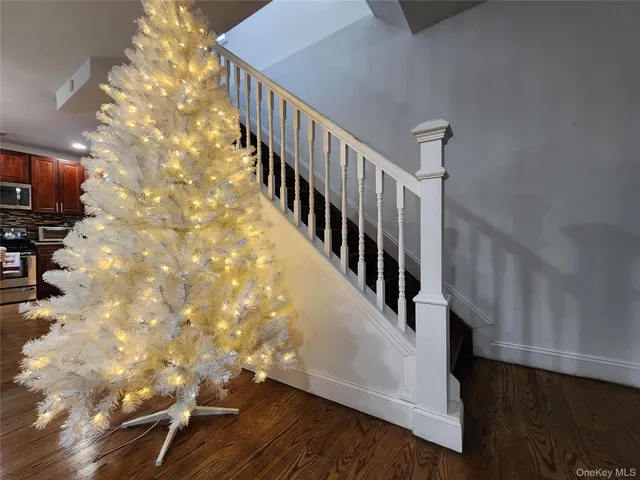 a view of entryway with wooden floor
