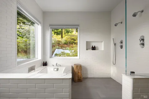a bathroom with a bathtub and a shower