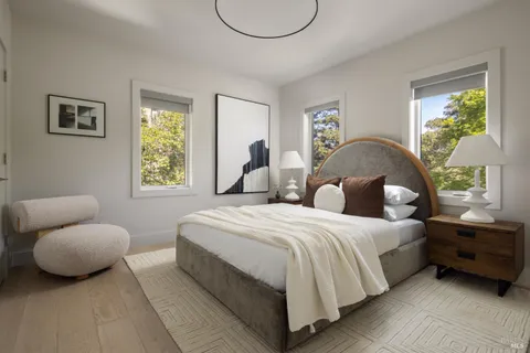 a bedroom with bed and window