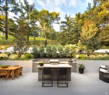 a view of a terrace with furniture and a fire pit